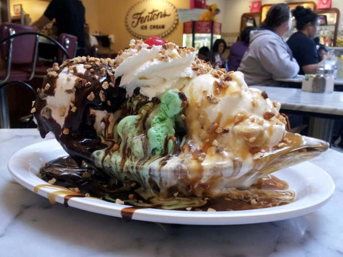 Fentons Creamery is a magical place where over-the-top sundaes spin in glass cases and waiters pour endless amounts of hot fudge. The 122-year-old creamery hasn