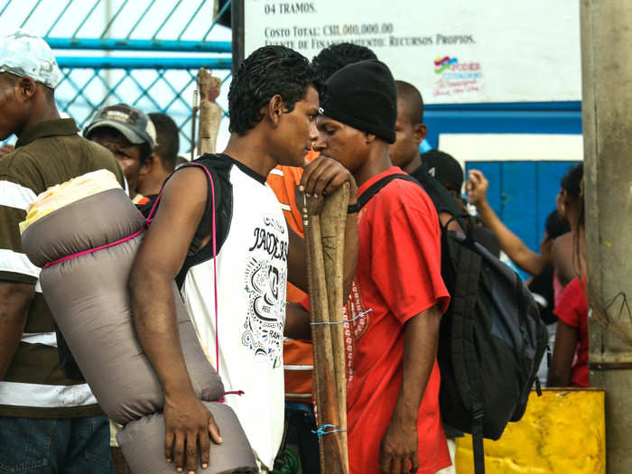 Lobster divers and their assistants wait for their name to be called at the dock in Puerto Cabezas. If your name isn