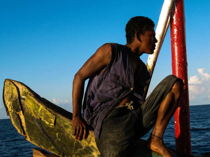 After releasing all of the canoes for the second of three diving sessions of the day, a deckhand takes a breather. These moments were the quietest on The Spanish Lady. You could actually hear the waves lapping the sides of the boat.