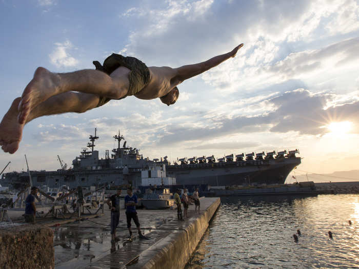 A Marine from the USS Kearsarge dives into the waters of Aqaba, Jordan.