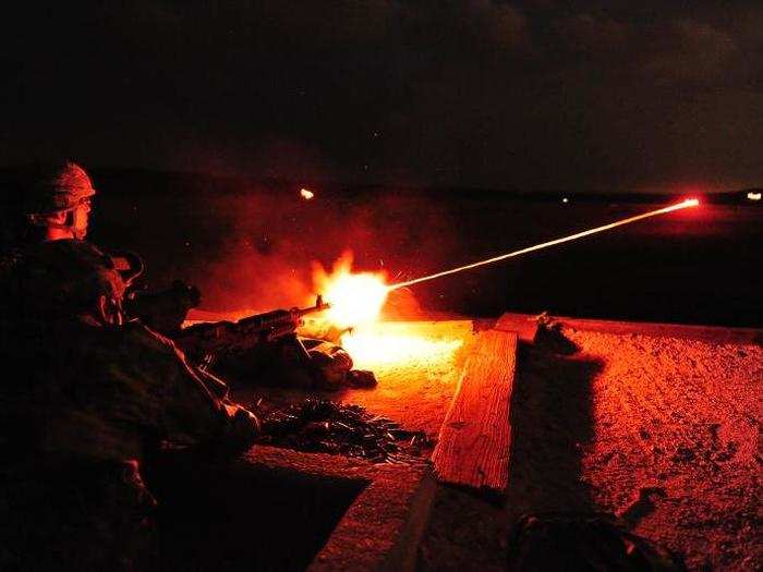 Soldiers from the Colorado Army National Guard fire tracer rounds from the M240B medium machine gun with the help of night optics at Fort Hood, Texas.