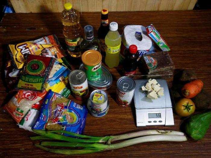 Grocery products lie next to coca paste worth $110,000 Colombian pesos at a local store in Guyabero Region, Guaviare, Colombia.