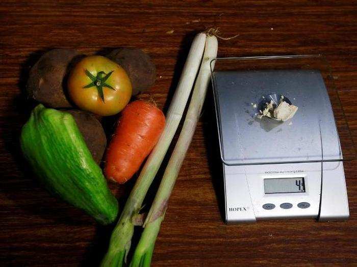 Vegetables lie next to coca paste worth $8,000 Colombian pesos at a local store in Guyabero Region, Guaviare, Colombia.