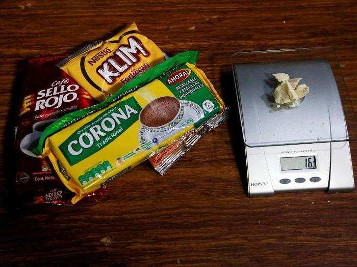 Grocery products lie next to coca paste worth $32,000 Colombian pesos at a local store in Guyabero Region, Guaviare, Colombia.