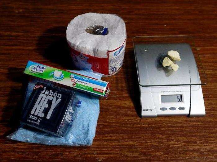 Cleaning products lie next to coca paste worth $18,000 Colombian pesos at a local store in Guyabero Region, Guaviare, Colombia.