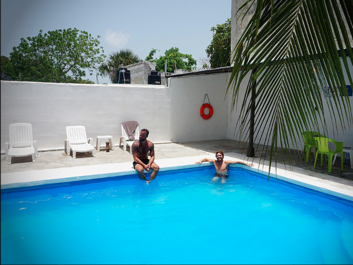 Fantasy: Cooling off in a serene, palm-fringed pool at Hostel El Corazon in Cancun.