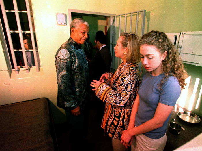 Nelson Mandela showed Clinton and Chelsea the cell in which he was held for 27 years at the Robben