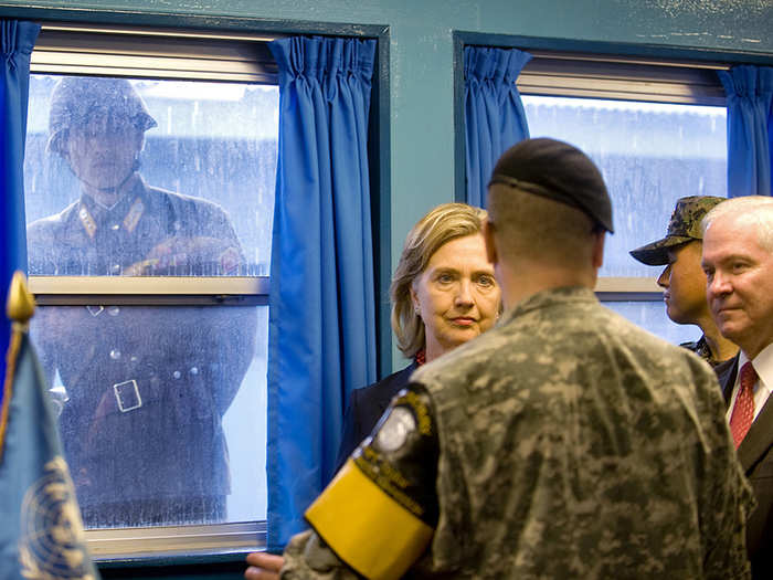 A North Korean soldier looks in through the window as Hillary tours the Demilitarized Zone in Panmunjom, South Korea, in 2010.