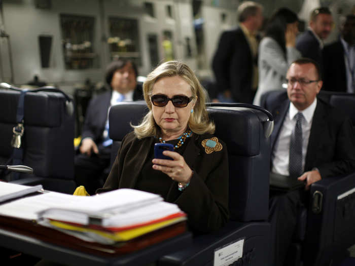 This is the badass pic that launched a thousand memes. Hillary looks cool as a cucumber checking her phone on a military C-17 plane to Libya in 2011.