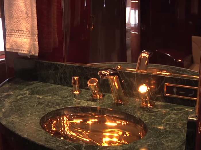 ... a master bath with 24-karat gold fixtures and ...