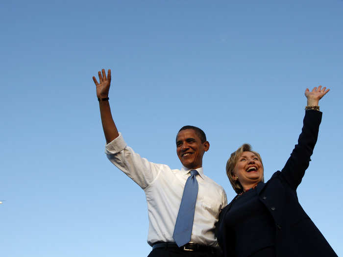 Barack Obama and Hillary Clinton wave at a campaign rally in Orlando, Florida, October 20, 2008.