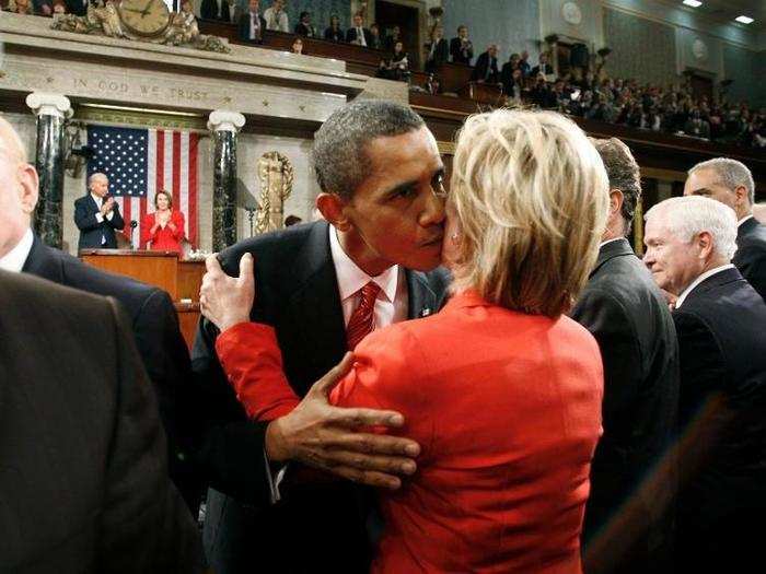 President Barack Obama kisses Secretary of State Hillary Clinton after his speech about healthcare reform before a joint session of Congress on Capitol Hill in Washington, September 9, 2009.