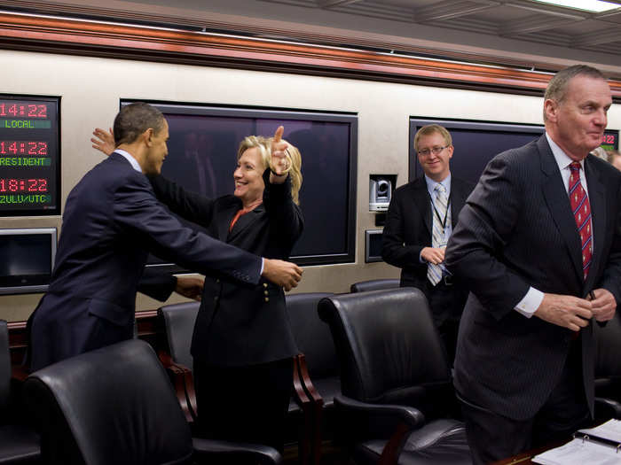 Secretary of State Hillary Rodham Clinton congratulates President Barack Obama on the House vote to pass health care reform, prior to a meeting in the Situation Room of the White House, March 22, 2010.