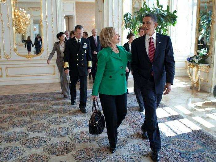 President Barack Obama talks with Secretary of State Hillary Clinton following the expanded delegation bilateral meeting with President Dmitry Medvedev of Russia at Prague Castle in Prague, Czech Republic, April 8, 2010.