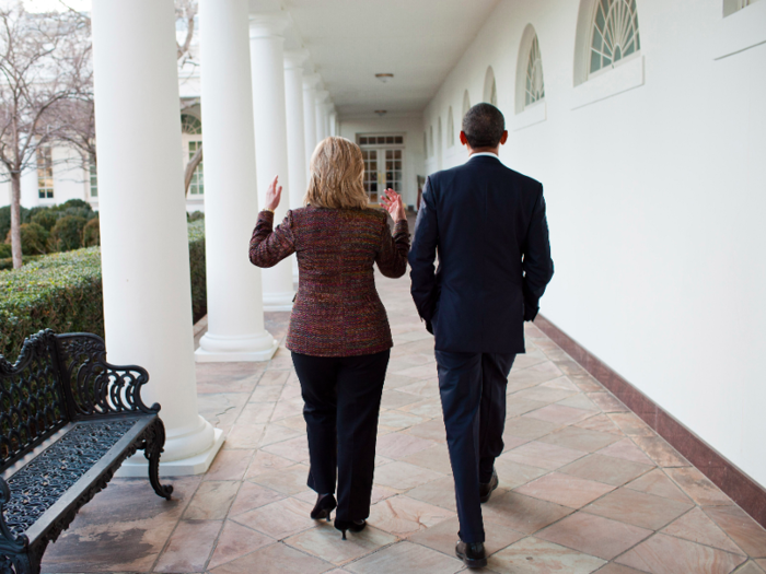 President Barack Obama walks along the Colonnade of the White House with Secretary of State Hillary Clinton after making a statement on the situation in Libya, Feb. 23, 2011.