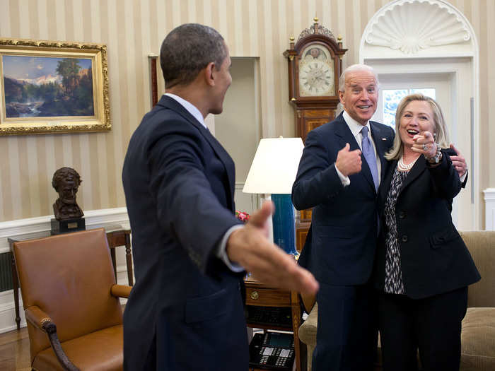 Secretary of State Hillary Clinton points at the camera after accidentally dropping all of her briefing papers onto the Oval Office rug.