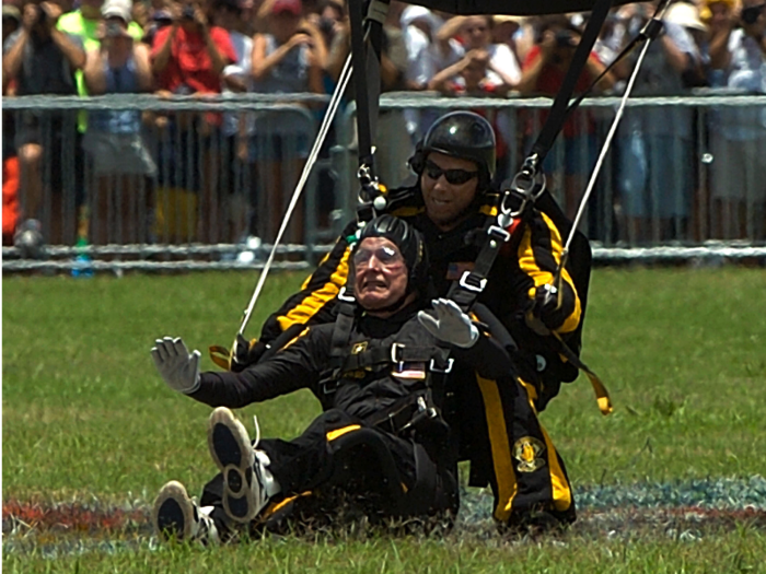 He’d planned to dive alone, but windy, cloudy conditions necessitated a tandem jump. Bush paired up with a member of the Golden Knights, the US Army’s official team for parachute demonstrations and competitions.