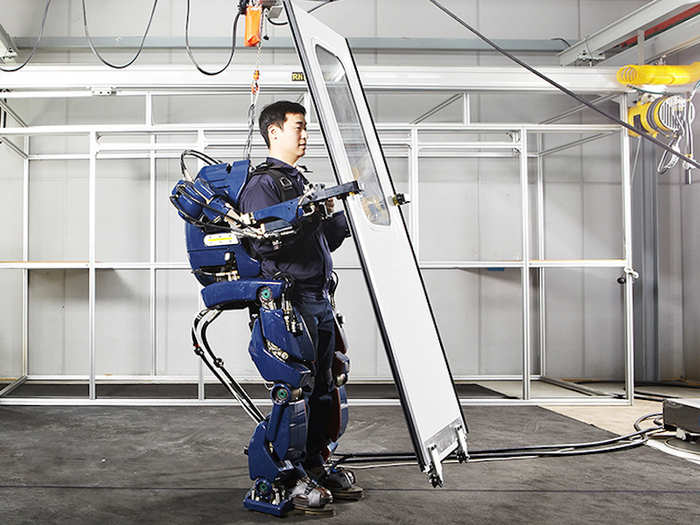 Construction workers will wear exoskeletons to carry heavy equipment.