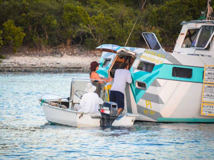 The couple told Bloomberg they get a range of customers — from yachts to dinghies and everything in between. One customer actually swam up to the boat.