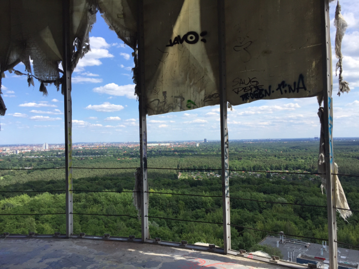 The fabric that covers the dome structures has been ripped and torn, either by the elements or by vandals/artists.