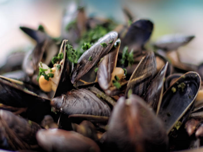 Moules Marinières is a French dish from Normandy and translates to sailor-style mussels. It