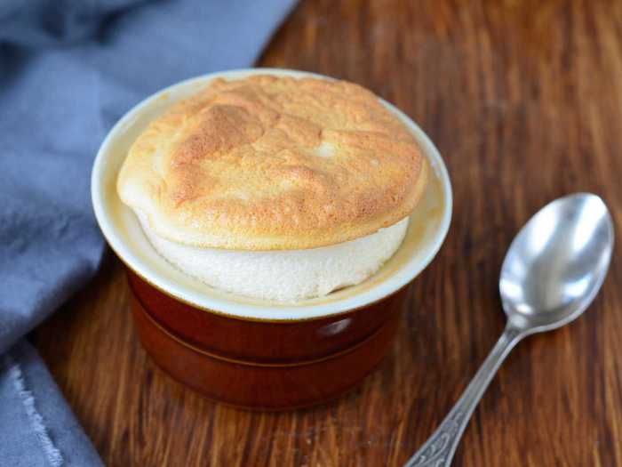 The name soufflé comes from the French verb "to blow;" the dessert is made with beaten egg whites and served directly from the oven while the puffy crust is still spilling over the dish. Prepared with an orange flavored cognac liqueur, the Grand Marnier soufflé is common in France.