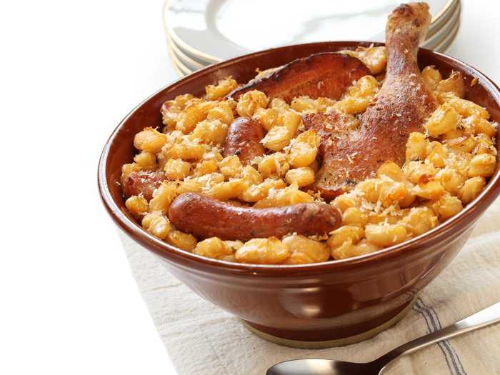 A combination between stew and casserole, cassoulet is comfort food at its finest. The dish originates from the south of France and is made with beans, duck meat, and pork skin.