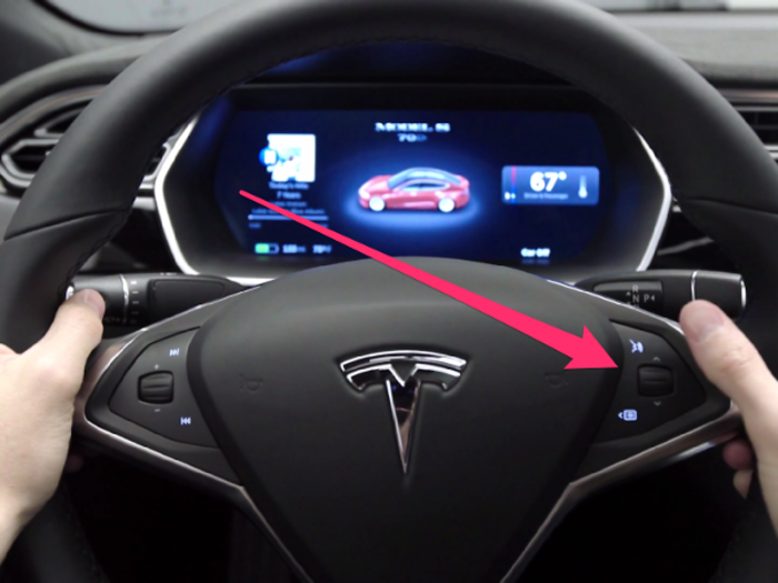 16. Buttons on the right side of the wheel can control Bluetooth-connected phones, complete voice commands and adjust various Model S features. A menu button on the right scroll wheel can change various settings like climate control and display brightness.