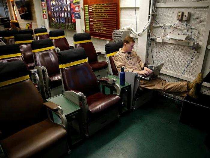 A pilot sits in the squadron room on board the USS Harry S. Truman aircraft carrier in the eastern Mediterranean Sea, June 14, 2016.