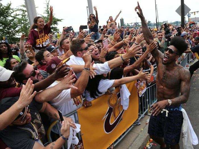 Fans and athletes partied together. People had to be kept behind barricades during the parade, but all was peaceful.