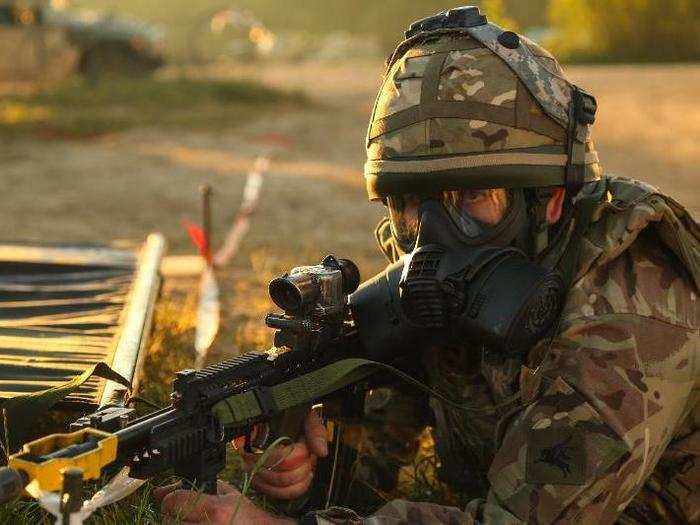 A British soldier provides security while conducting medical-evacuation simulations.
