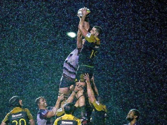 Hisa Sasagi of the Hurricanes and Sam Jeffries of the Rebels compete for the ball in a lineout during the Super Rugby Exhibition match in Melbourne, Australia.