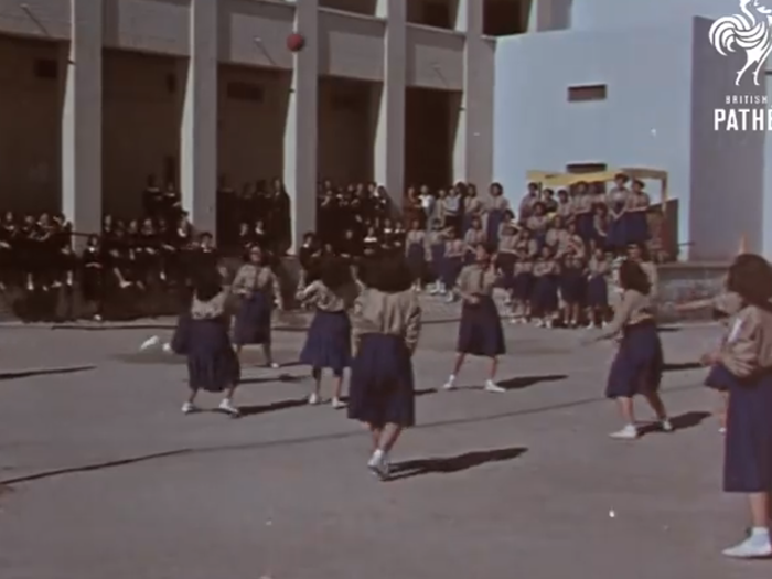 And girls were encouraged to go to school, where they studied and played games like volleyball.