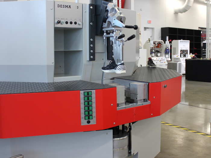 Another machine (pictured below) can mold ultra-light soles from a special dense foam, called EVA.