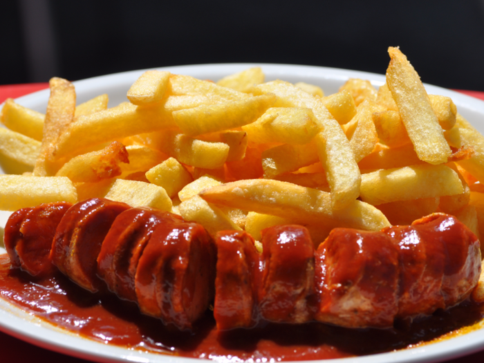 Eat currywurst at one of Berlin