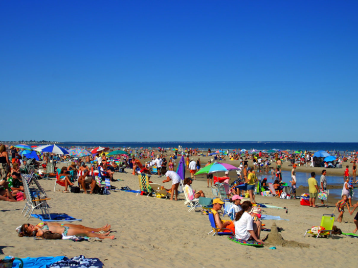 9. Ogunquit Beach in Ogunquit, Maine, includes three and a half miles of sandy beach and grassy dunes. Visitors can rent beach chairs and umbrellas for lounging, or boogie boards to enjoy the water.