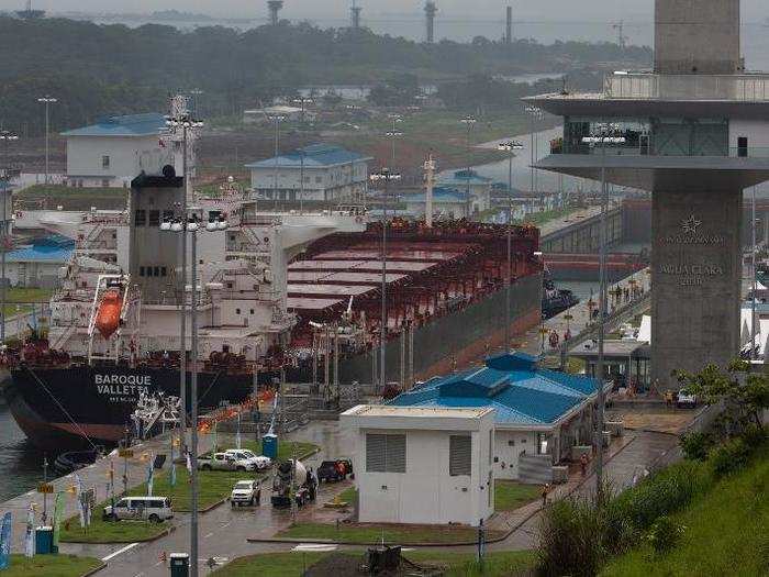 Another cargo ship navigates through the new locks on a test of the newly expanded Panama Canal.