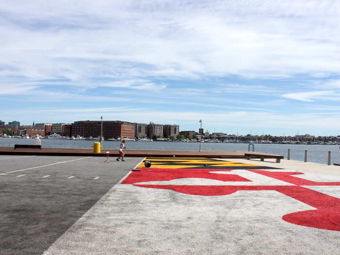 The gym is connected to an outdoor turf on the harbor, painted with the Maryland flag. During the day, people can work out individually or attend yoga or circuit training classes.