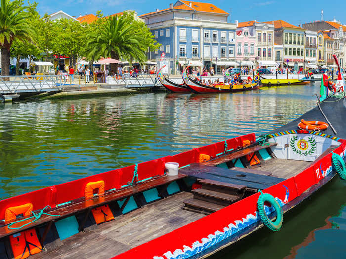 Hop on a colourful boat in Aveiro, a vibrant canal city that