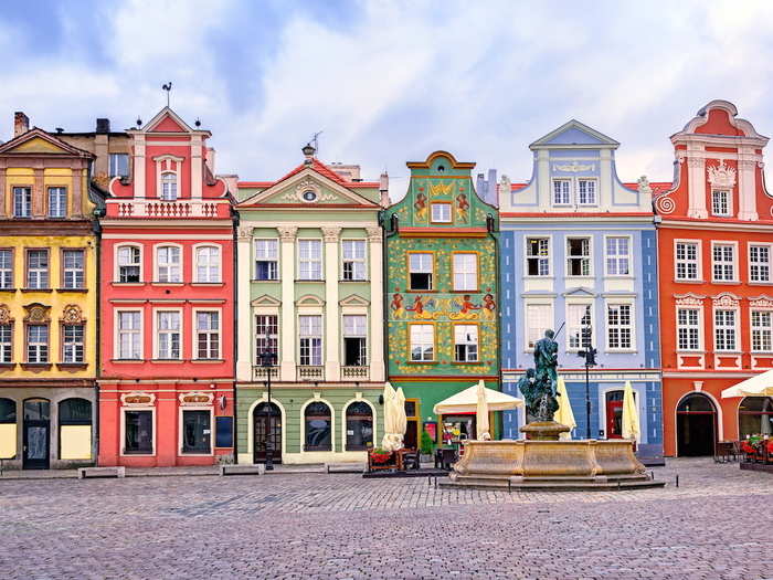 The market square bordered by neat rows of colourful buildings in Poznan, Poland, offers visitors a perfect photo opportunity.