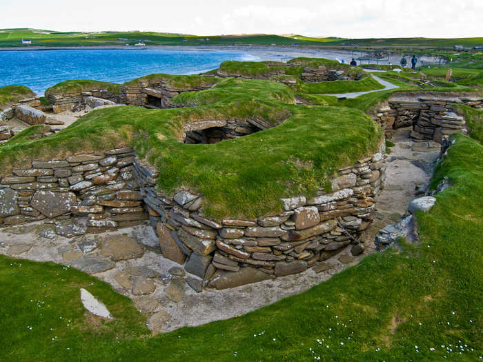 Look at ancient stone-made furniture at Skara Brae, the site of a Neolithic settlement on the Bay of Skaill in Scotland