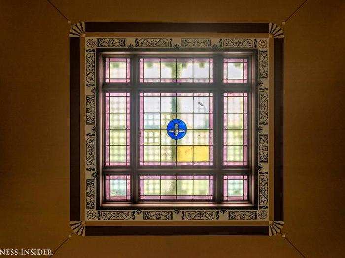 The stained glass skylight contains only one original panel; the rest had to be recreated.