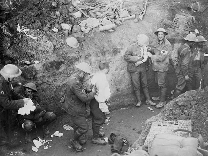 Wounded are dressed in a trench during the Courcelette operation of the Battle of the Somme, France on September 15, 1916.