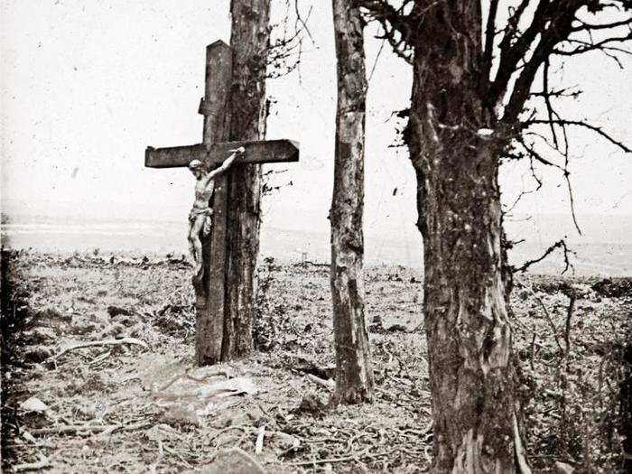 An archive picture taken shows a statue of Christ on the cross on a tree at Fricourt on the Somme front in France October 1916.