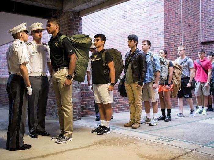 Cadet candidates receive orders from older cadets during the in-processing procedures.