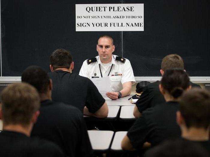 Cadet candidates read over their Oath of Allegiance paperwork during the in-processing procedures.