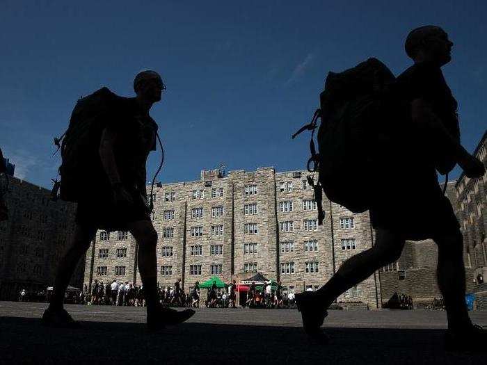 New cadets march in a courtyard on campus — something they