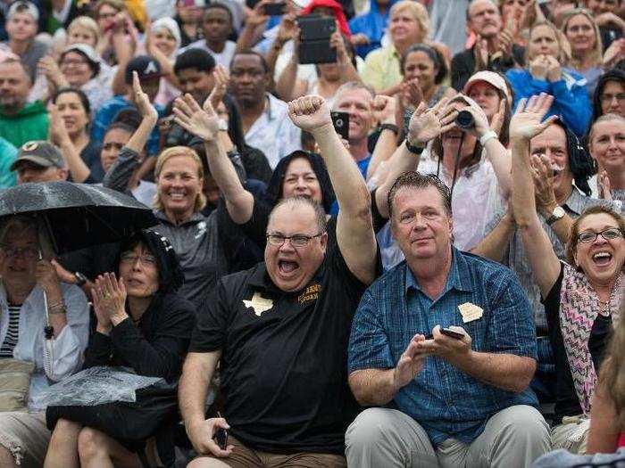 Parents and family members react to the new cadets during the ceremony.