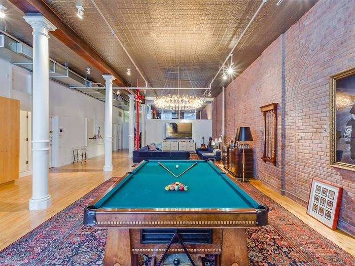 Levine and Prinsloo have eclectic taste, as evidenced by this giant pool table which gets a central spot in the loft.