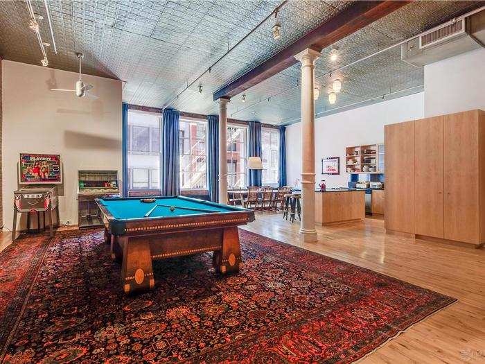 Vintage pinball machines and a jukebox are some of the other playful decorations in the loft.